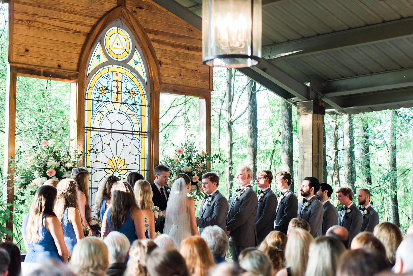 Southern Bride and Groom exchange vows in Rosegate Chapel, Mississippi wedding venue