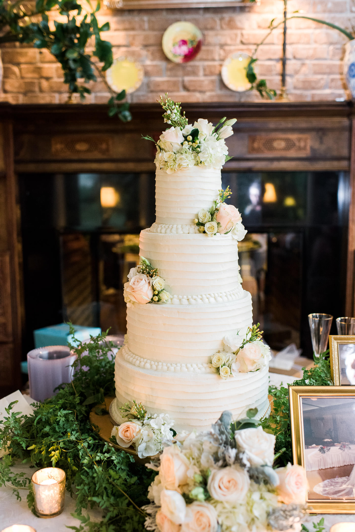 Beautiful four layer cake with ruffles, peach roses and hydrangeas for Jackson, Mississippi wedding