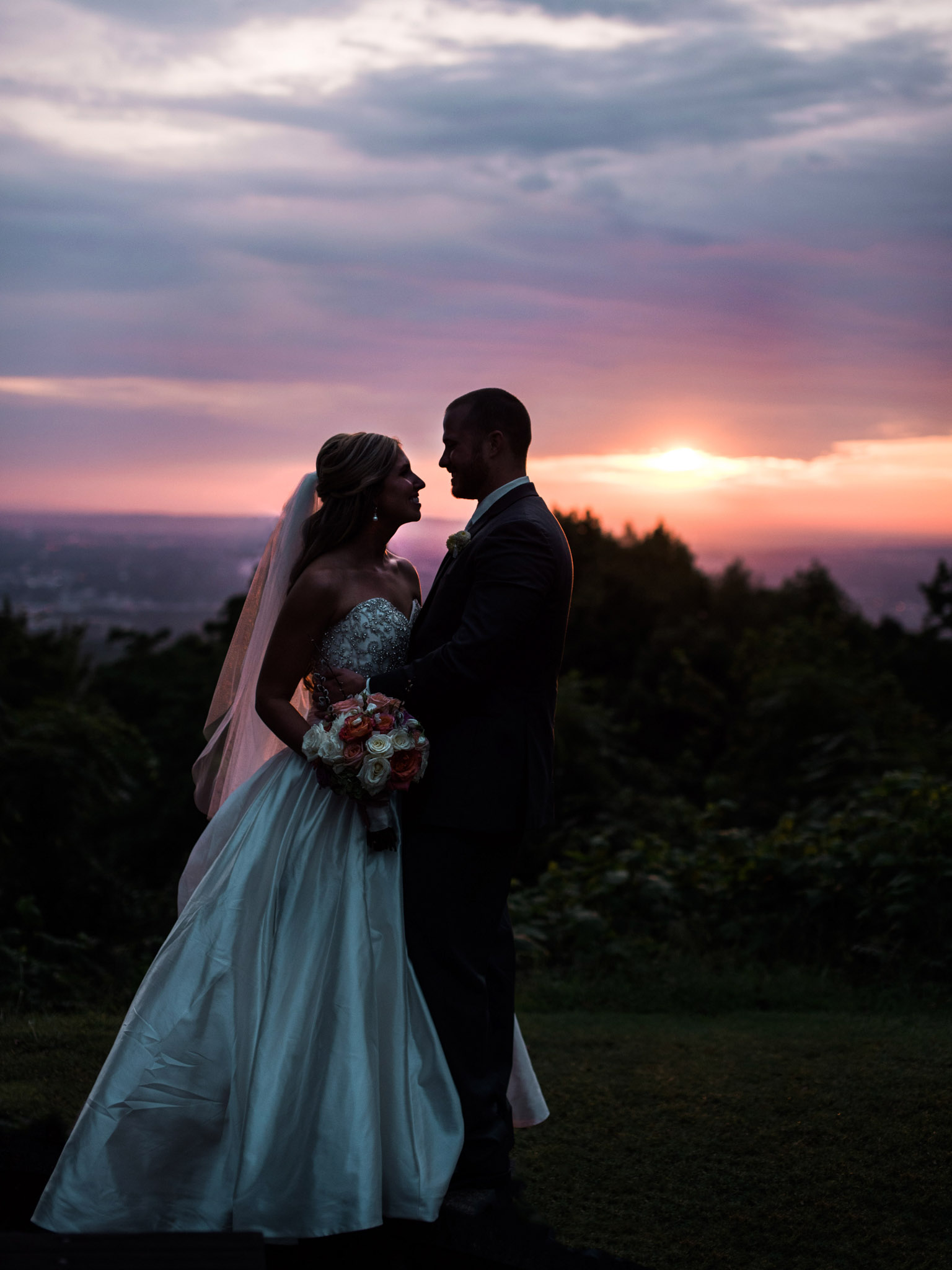 Bride and Groom silhouette in Alabama sunset on Burritt on the Mountain at Alabama wedding