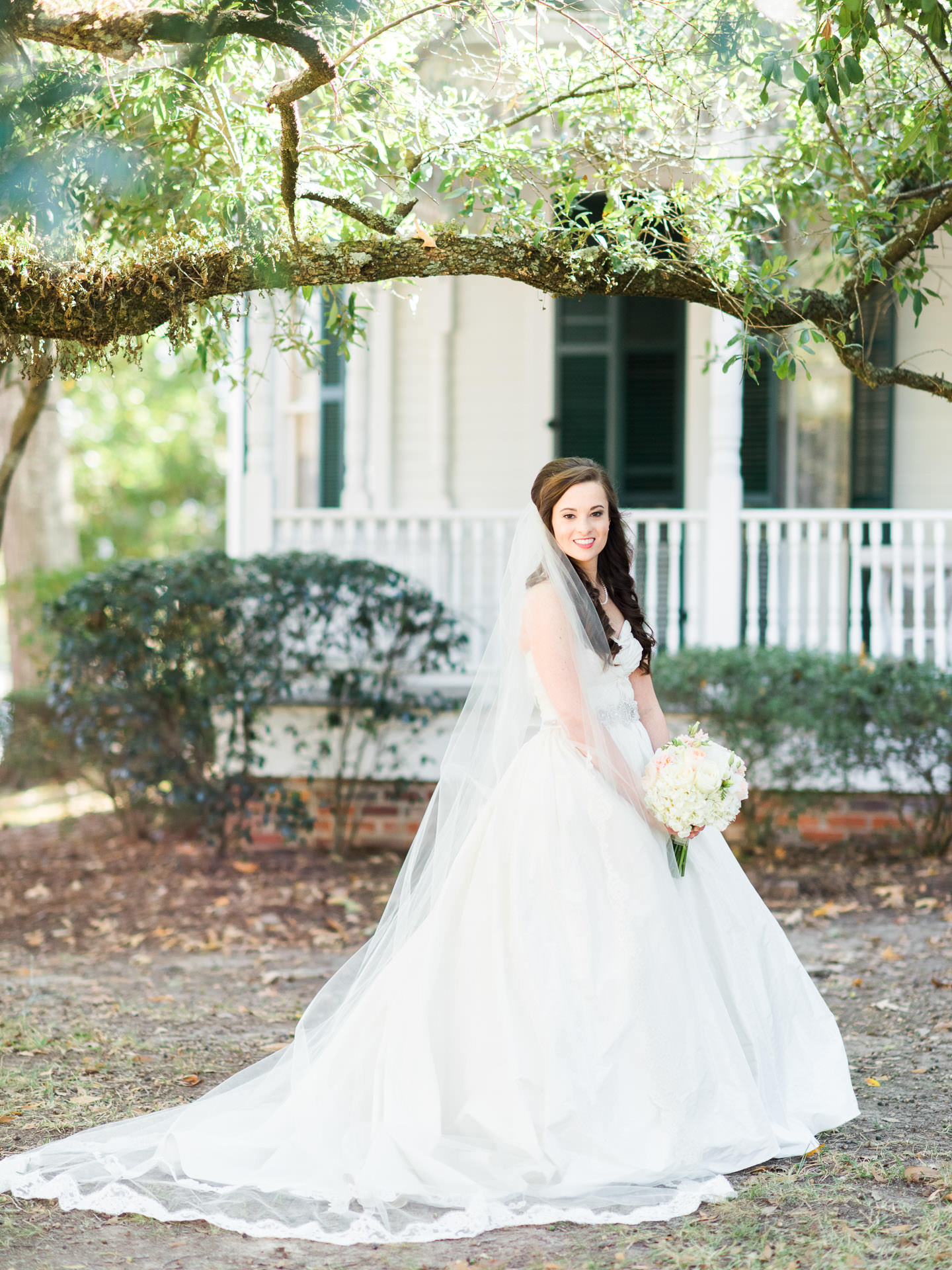 Mississippi Bride with cathedral veil smiling